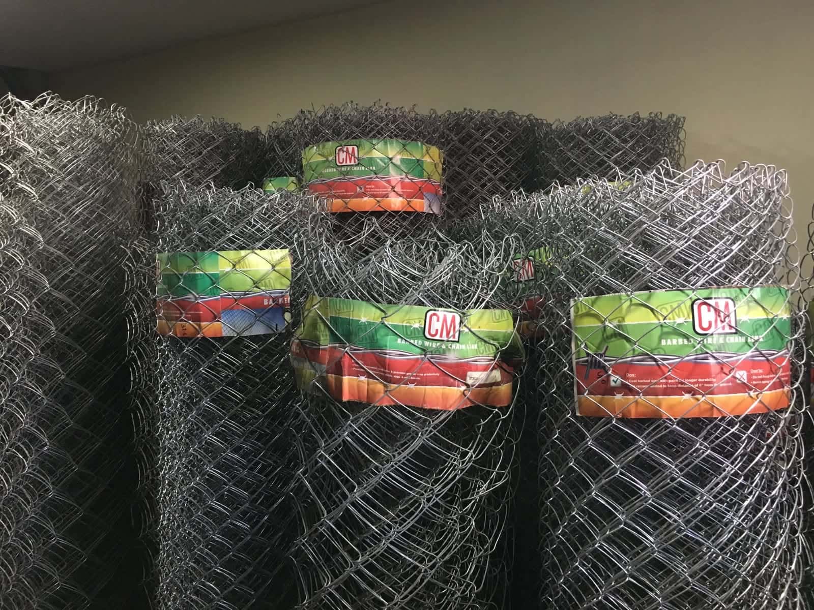 CM brand chain link fencing rolls stacked at the HM Ibrahim & Co shop