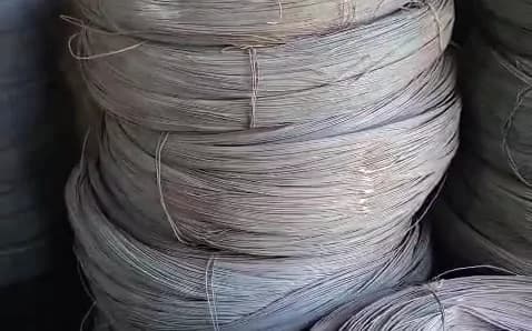 Heavy coil of black annealed wire in close-up