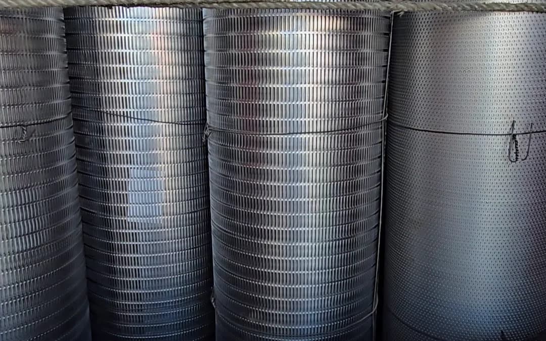 Perforated sheets rolled and stacked in a truck