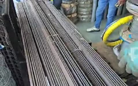 Steel bars bundled and tied on a table for inspection