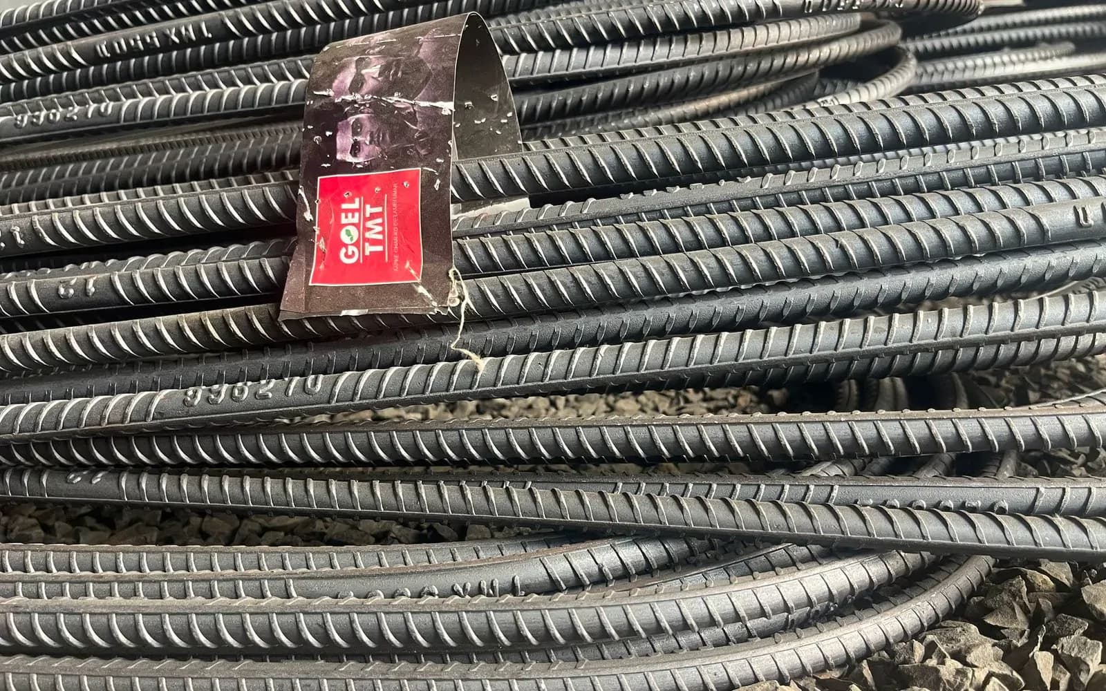 Bundles of TMT bars stacked at a steel yard