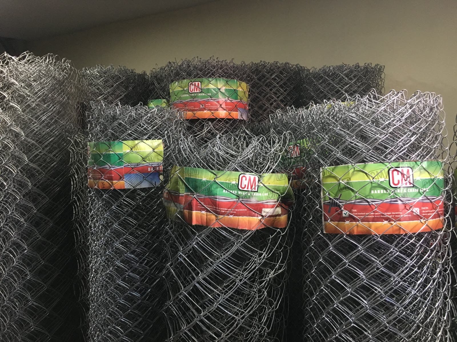 CM brand chain link fencing rolls stacked at the HM Ibrahim & Co shop