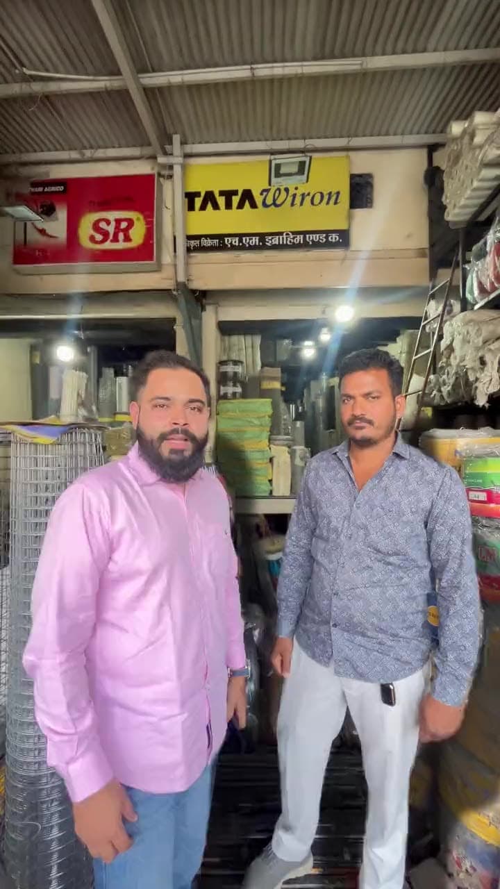 At the counter in the Siyaganj shop, under the Tata Wiron and SR signs