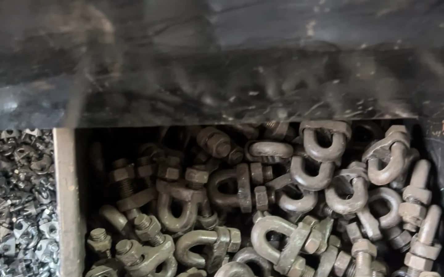 Bins of nuts, bolts and wire rope clips