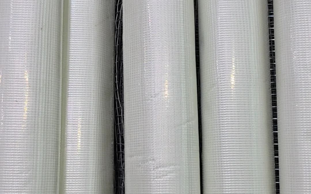 White fibre mesh rolls standing in a row