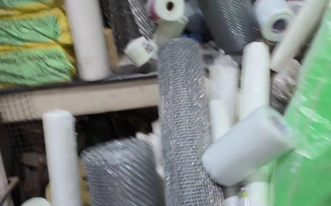 Fibre mesh rolls beside GI wire mesh in the godown