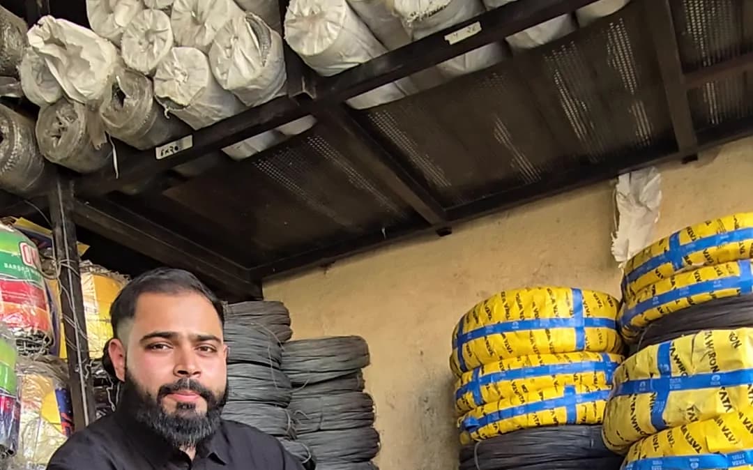 Tata Wiron coils in yellow packing next to loose black wire