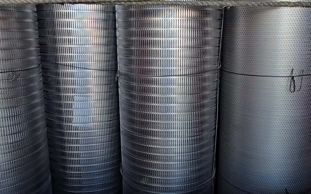 Perforated sheets rolled and stacked in a truck