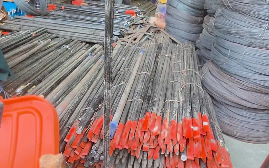 Bundles of MS rods and angles with painted ends at the counter