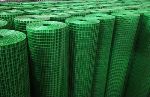 Green PVC coated weldmesh rolls in warehouse